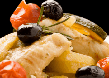 Traditional Italian stockfish dish served with Mediterranean ingredients