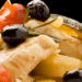 Traditional Italian stockfish dish served with Mediterranean ingredients