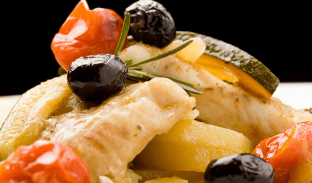 Traditional Italian stockfish dish served with Mediterranean ingredients
